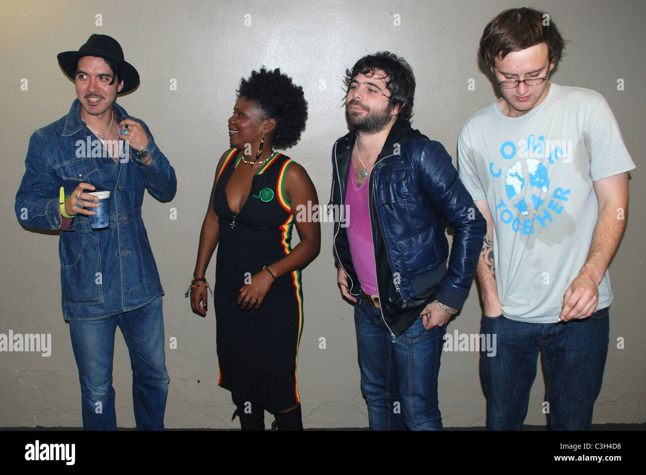 Jonn Dunn, Julie E. Gordon , Mikey Shine and Jacob Ryder ( nephew of lead singer Shaun Ryder) The Happy Mondays backstage at Stock Photo