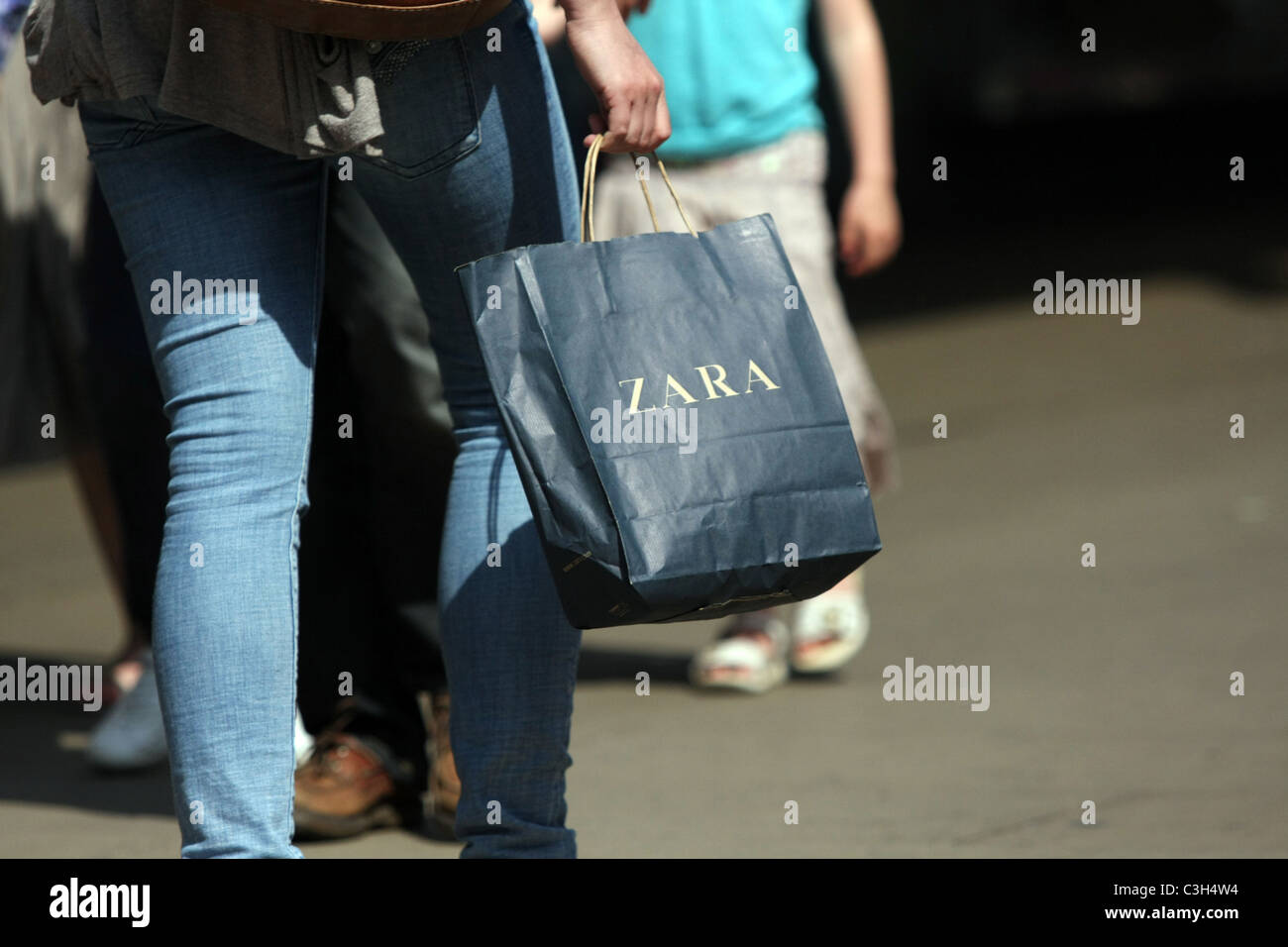 Shopping bag being carried in Oxford Street, London, England Stock ...