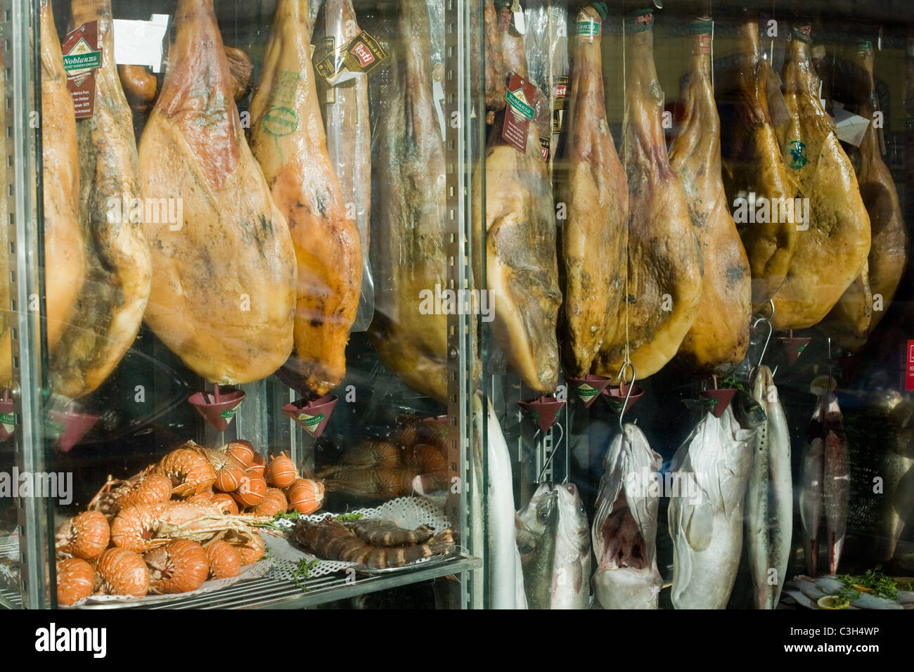 Meats and fish and shellfish in restaurant window, Lisbon, Portugal