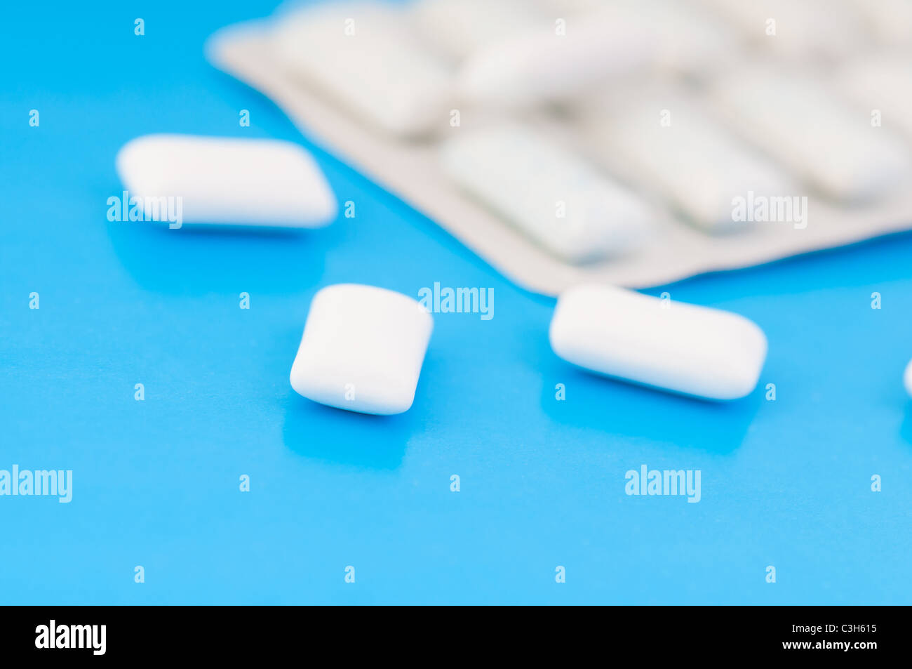 Chewing gums on blue Stock Photo - Alamy