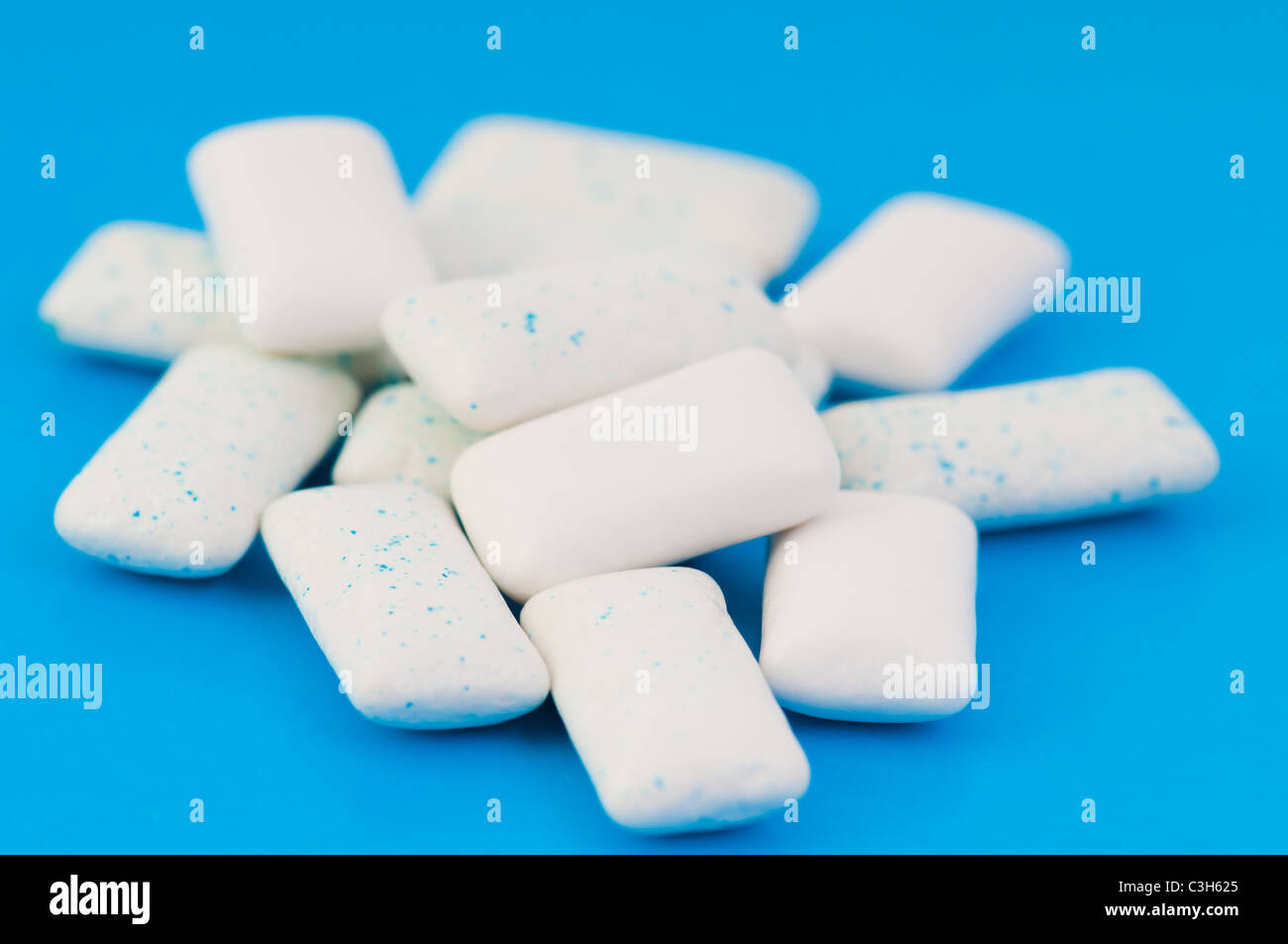 Chewing gums on blue Stock Photo Alamy