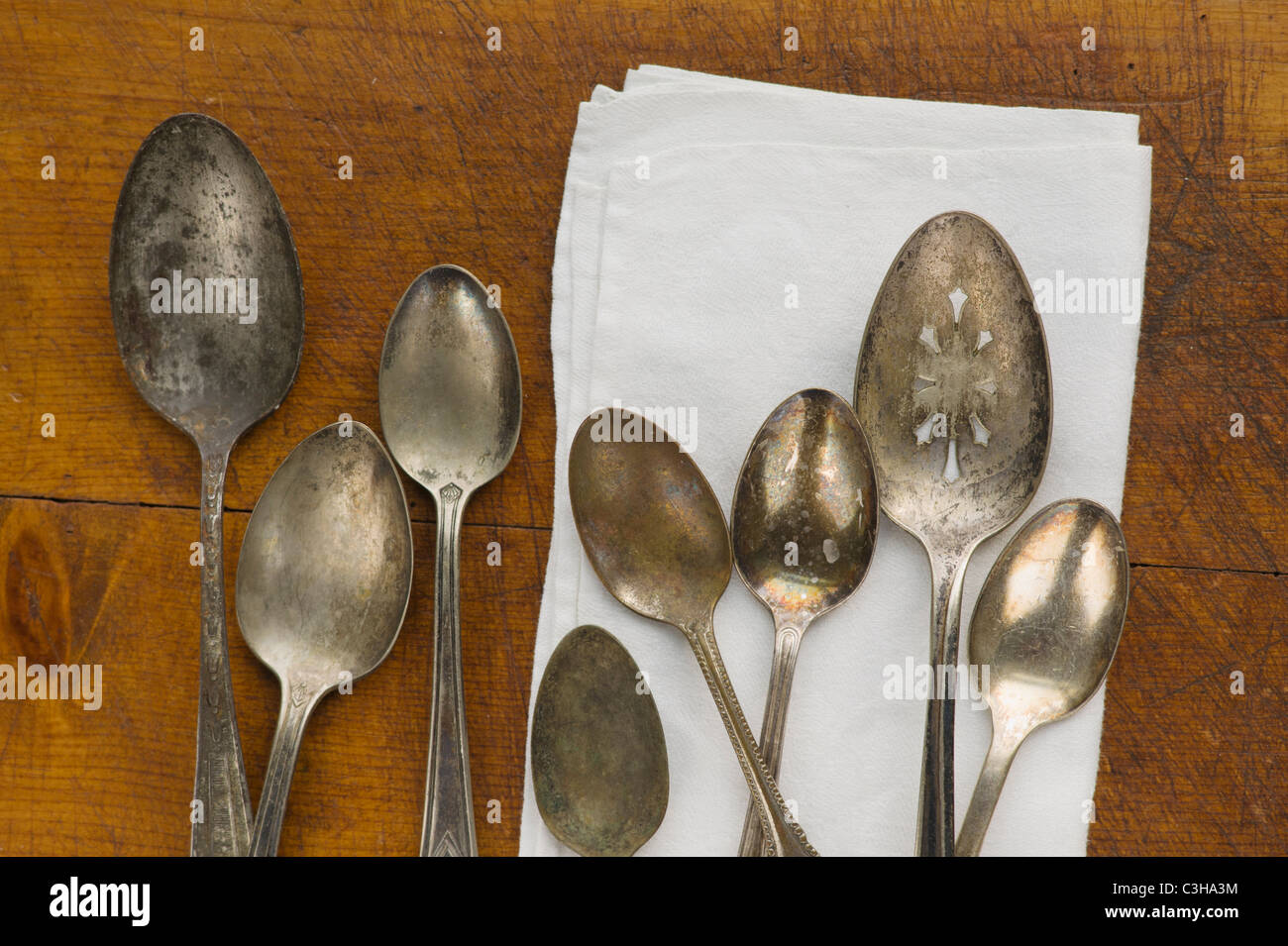 Close up of rusty silver spoons and napkin Stock Photo