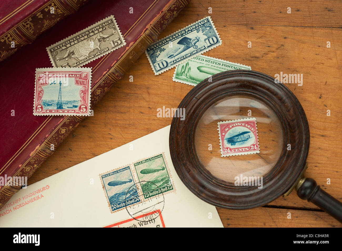 Close up of stamps collection and magnifying glass Stock Photo