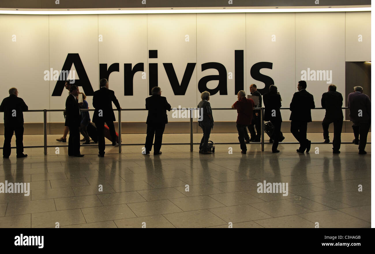 Airport arrivals waiting area London Heathrow airport terminal 4 Stock Photo