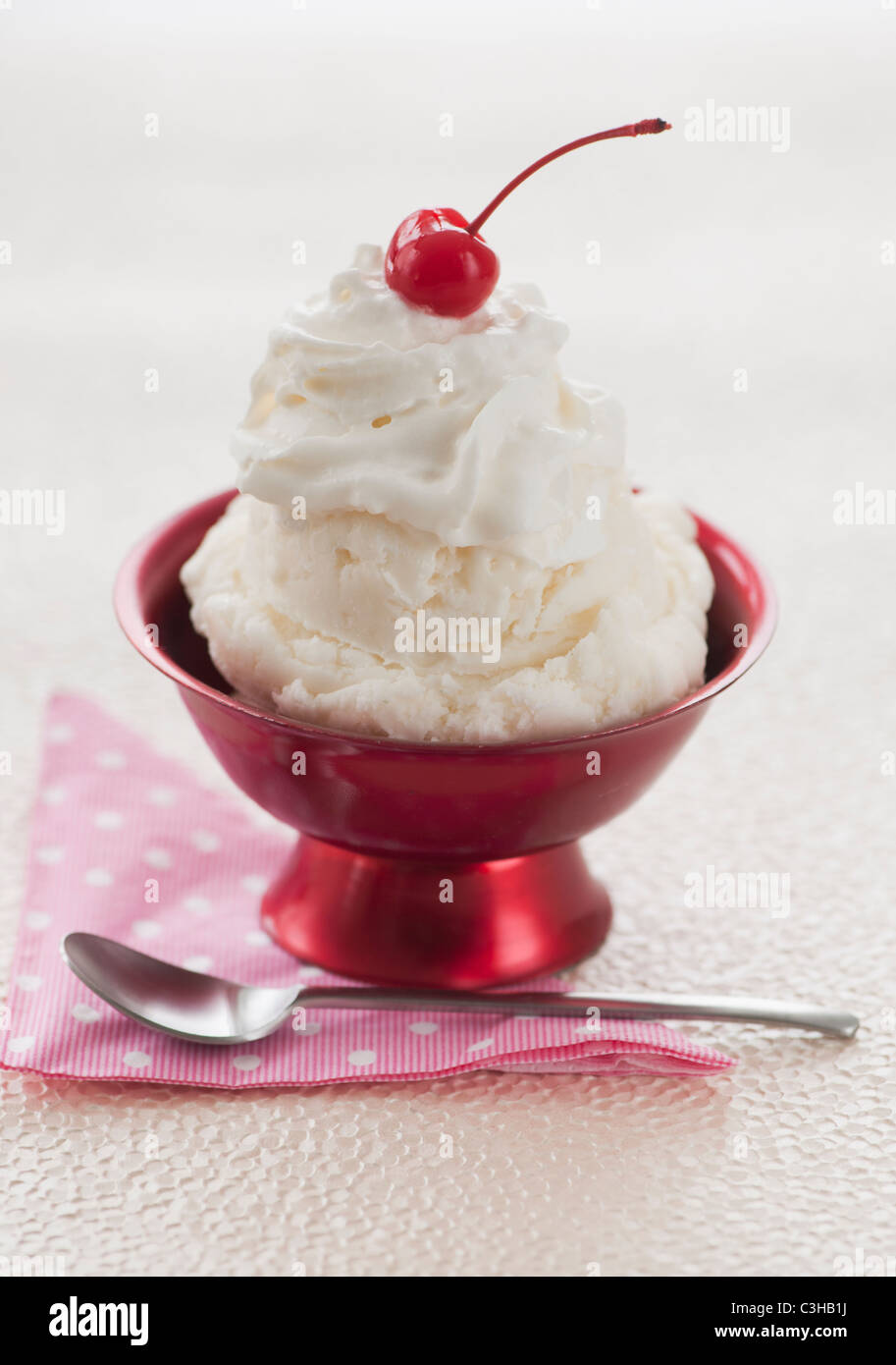 Close up of ice cream with cherry on top Stock Photo