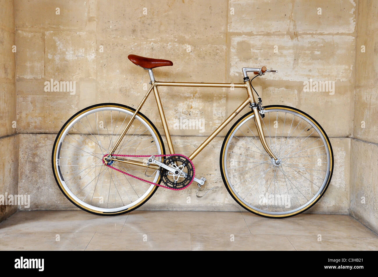 Vintage fixed gear bicycle with a pink chain Stock Photo