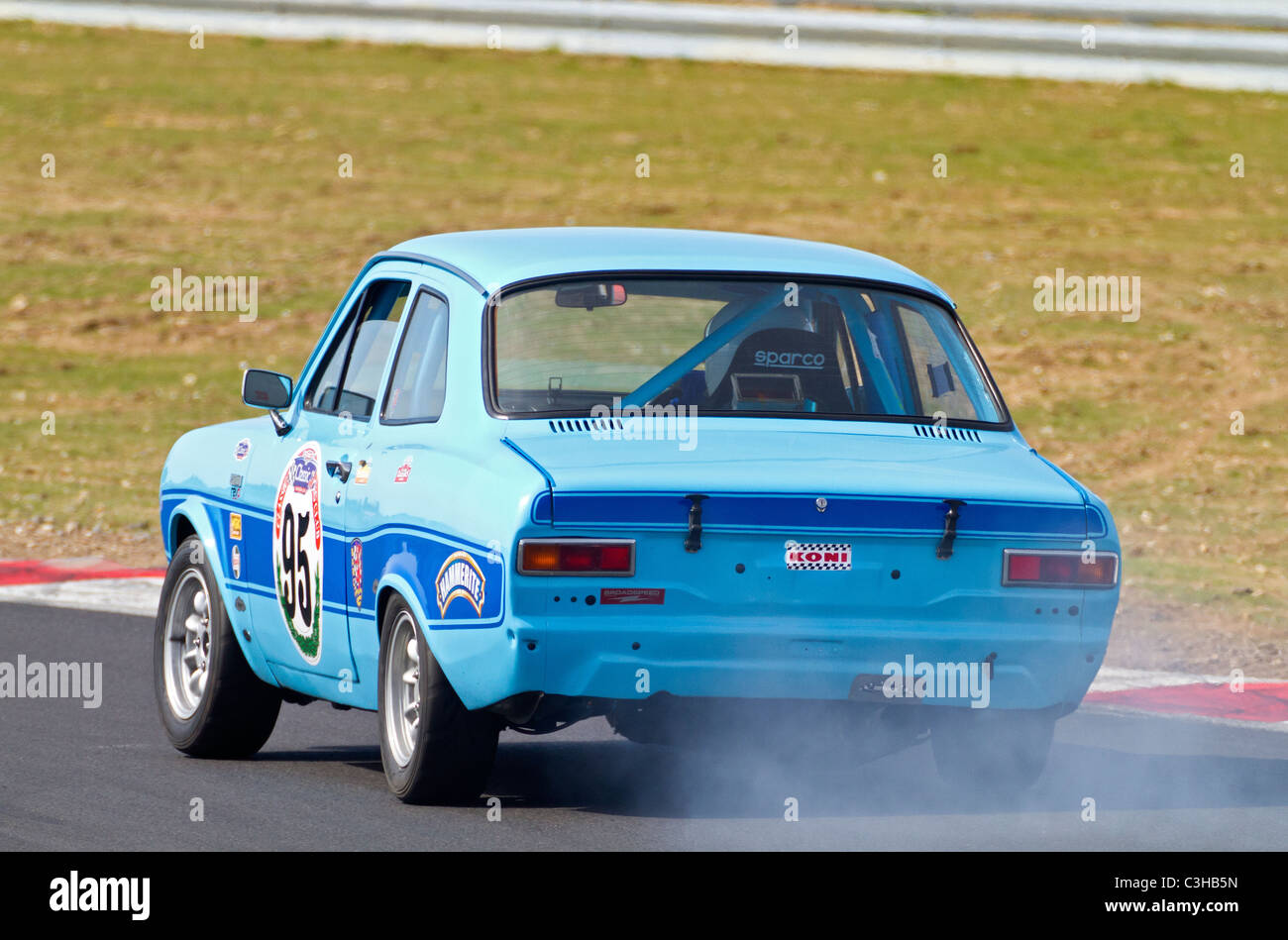 1973 Ford Escort Mk1 with driver Len Allgood during the CSCC Swinging Sixties Series race at Snetterton, Norfolk, UK. Stock Photo
