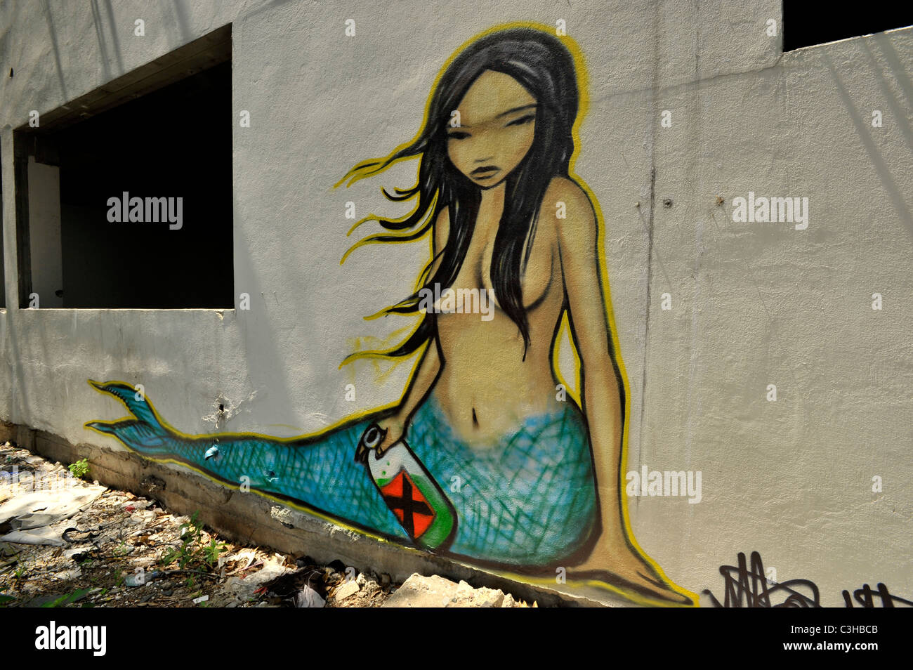 thai mermaid , graffiti on the wall, expressionism and social messaging, weird and bizarre art, bangkok, thailand Stock Photo