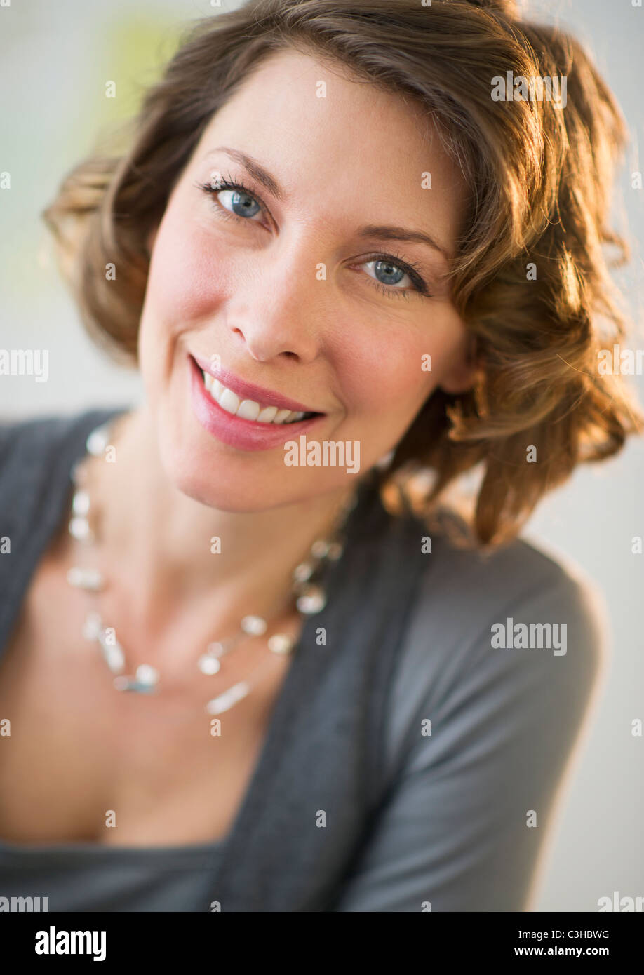Portrait of smiling woman Stock Photo - Alamy
