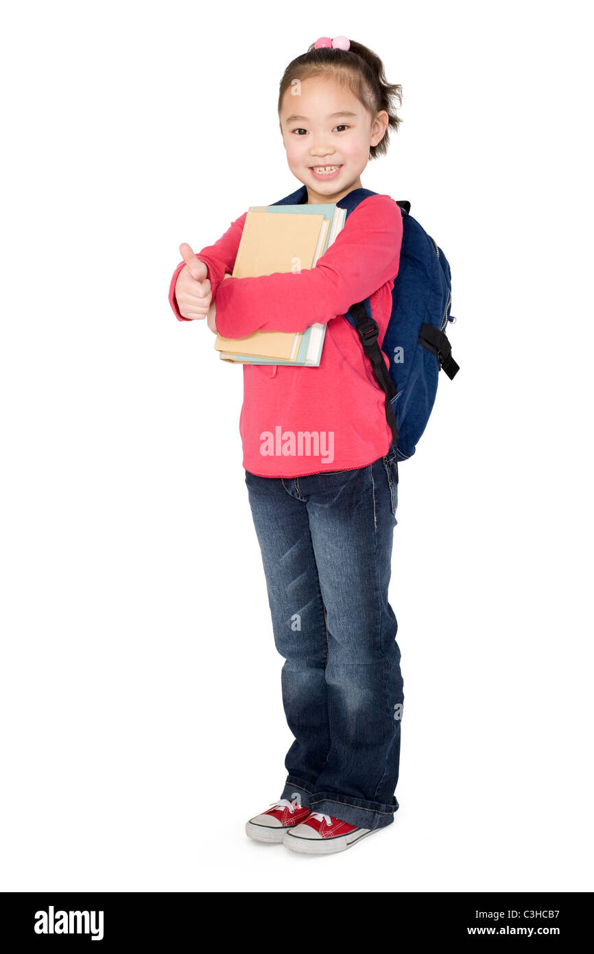 A young girl holding books and giving a thumbs up Stock Photo - Alamy