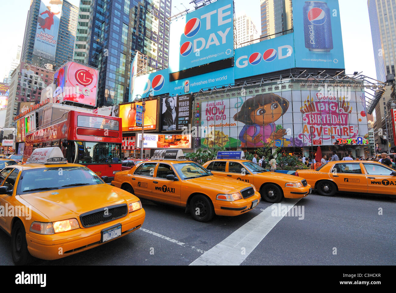 Crown Victoria Taxis on Broadway in Times Square, New York City may soon be replaced with Nissan Minivans. Stock Photo