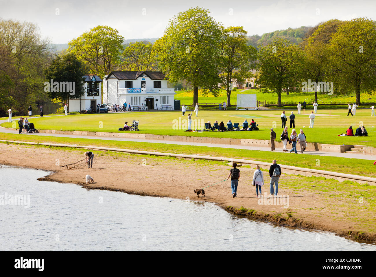 A cricket match in Roberts Park, Saltaire, UK. Stock Photo