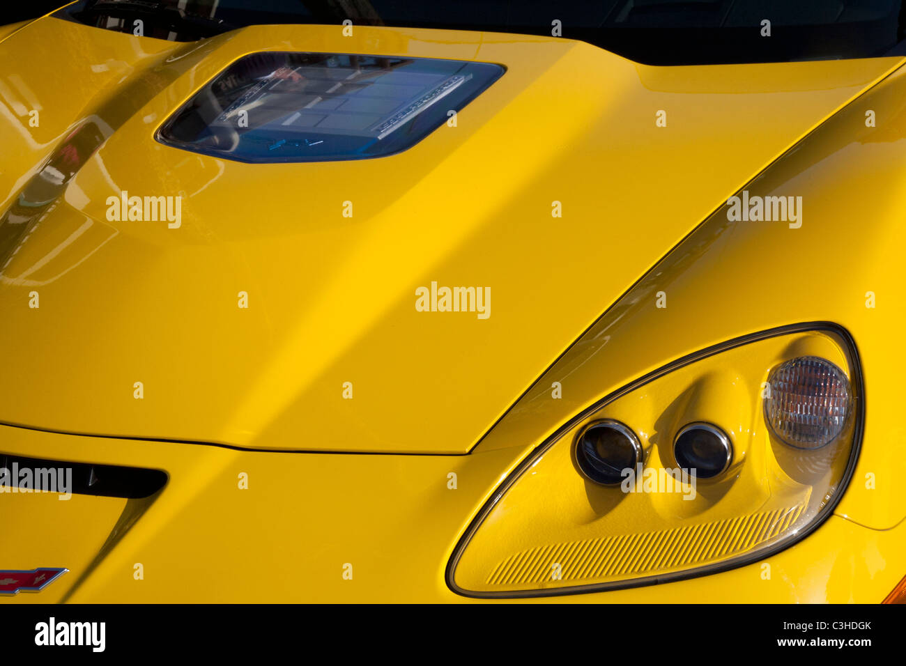 Detail of Front End of Yellow Corvette Stock Photo