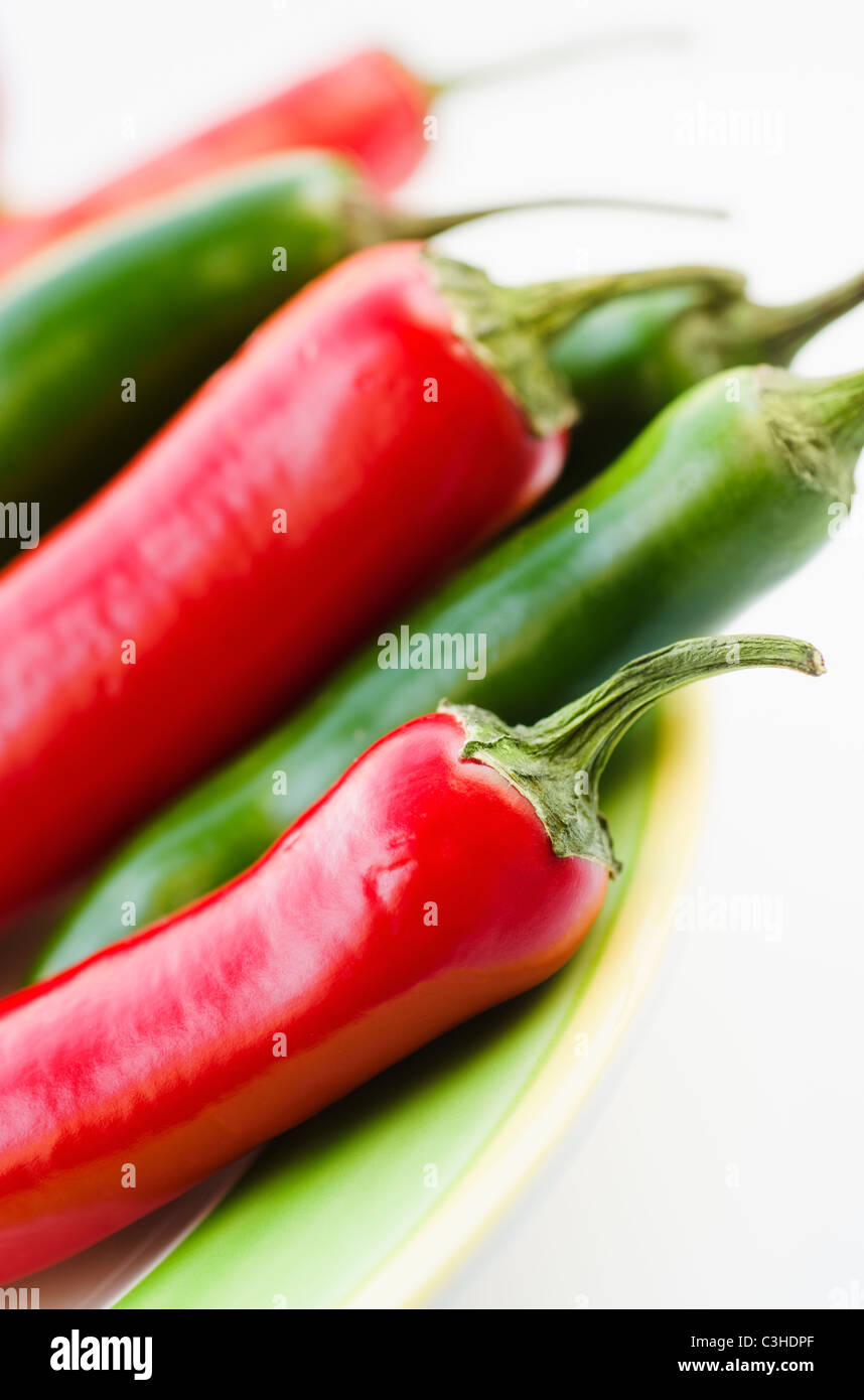 Studio shot of red and green Chili Peppers Stock Photo - Alamy