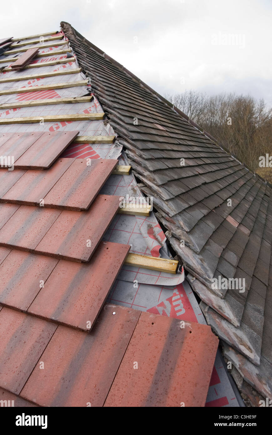 Re Roofing Detail with Old Rosemary Roof Tiles and New Larger Modern Marley Tile, by Ontop Roofing, Sheffield, England Stock Photo