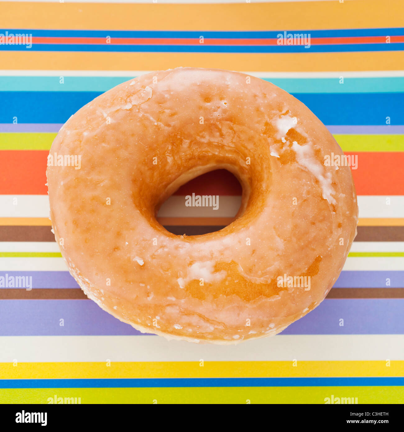 Studio shot of donut on striped background Stock Photo