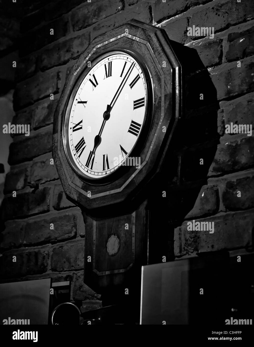 An old clock in a great farmhouse pub in denham village. Stock Photo
