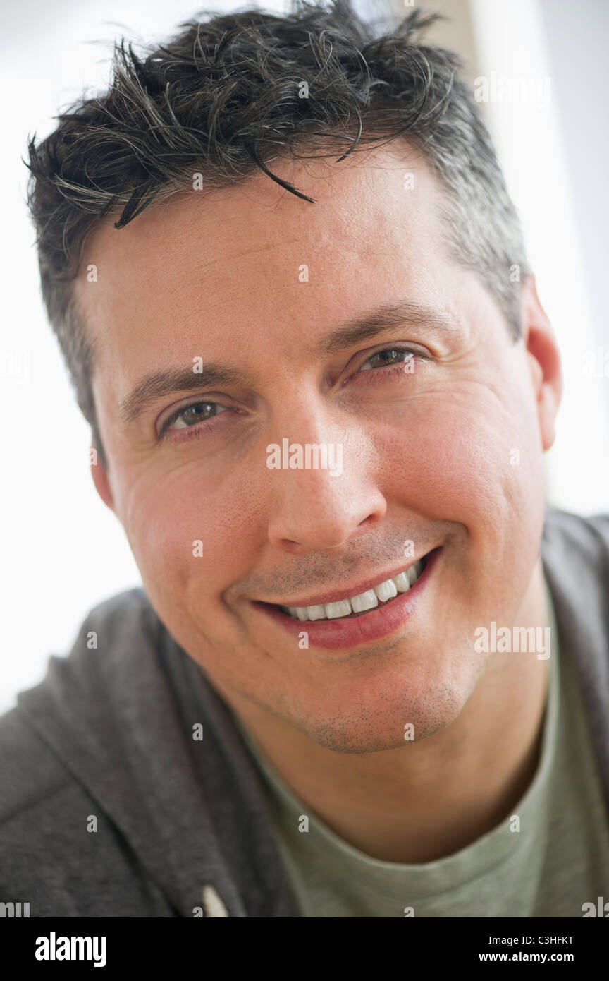 Portrait of mid adult man smiling Stock Photo