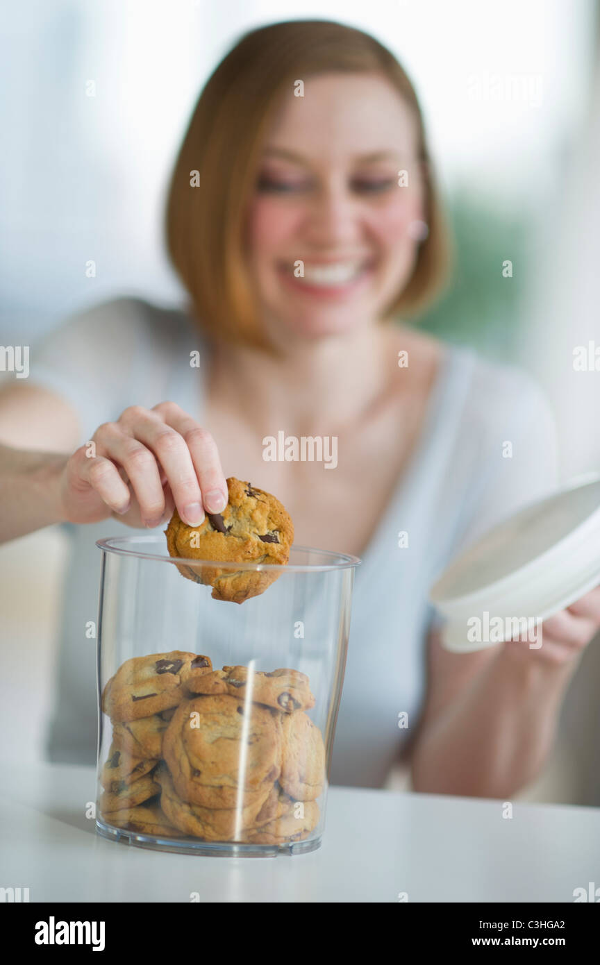 Woman eating cookies Stock Photo