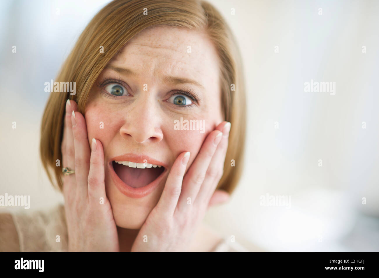 Portrait of shocked woman Stock Photo