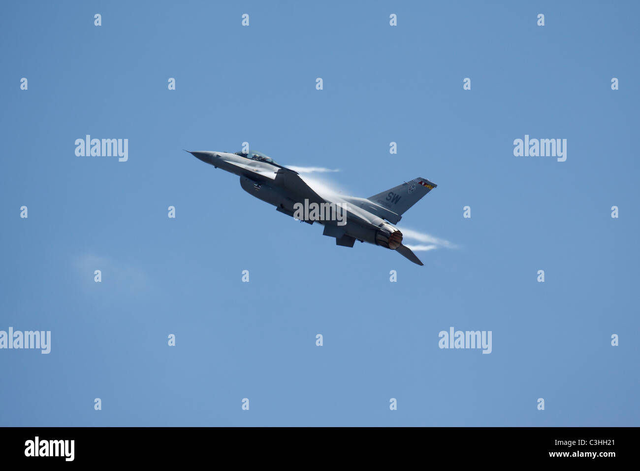 A Lockheed Martin F-16 fighting falcon in flight. Stock Photo