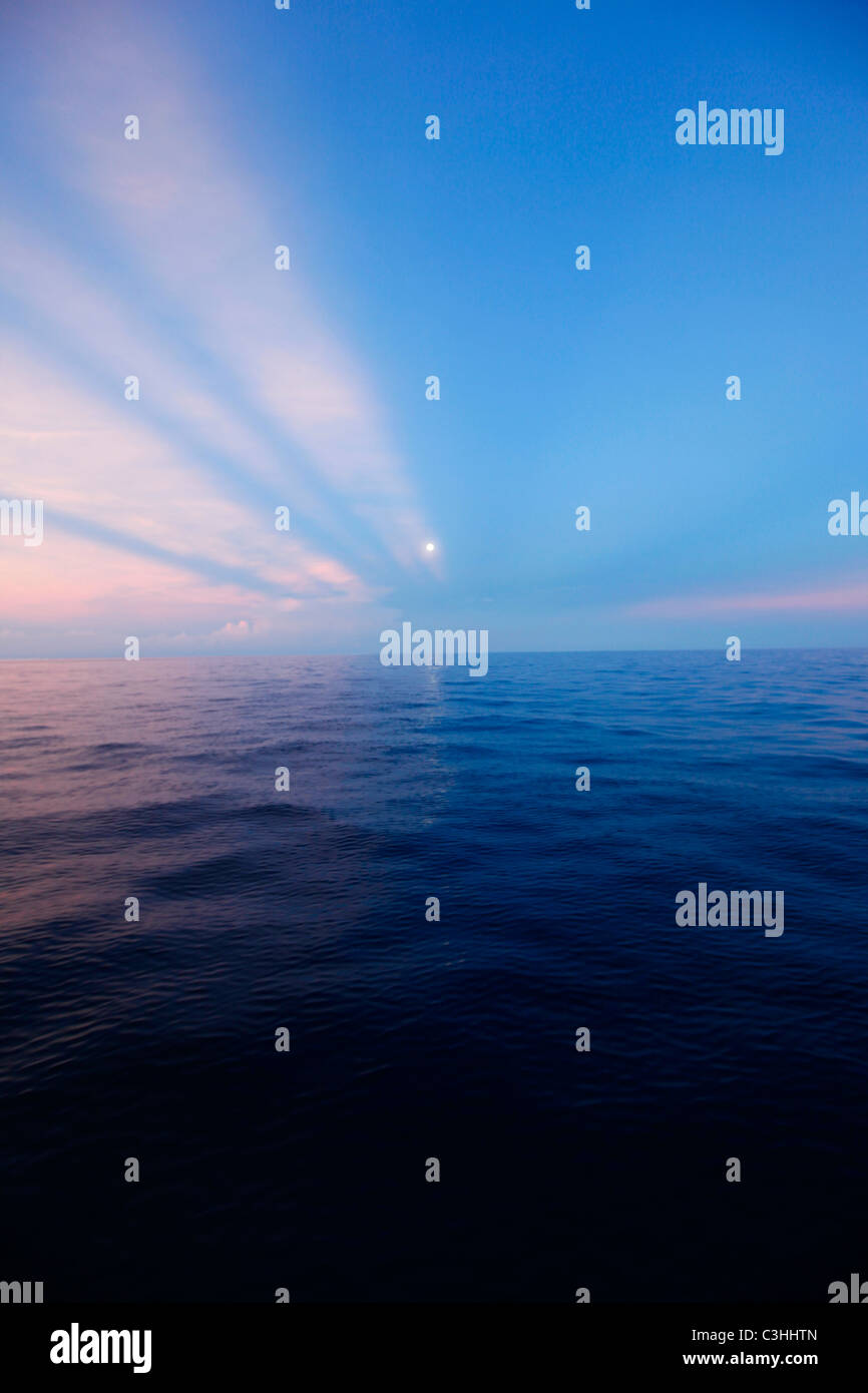 Full moonset, Mamanucas, Fiji Stock Photo