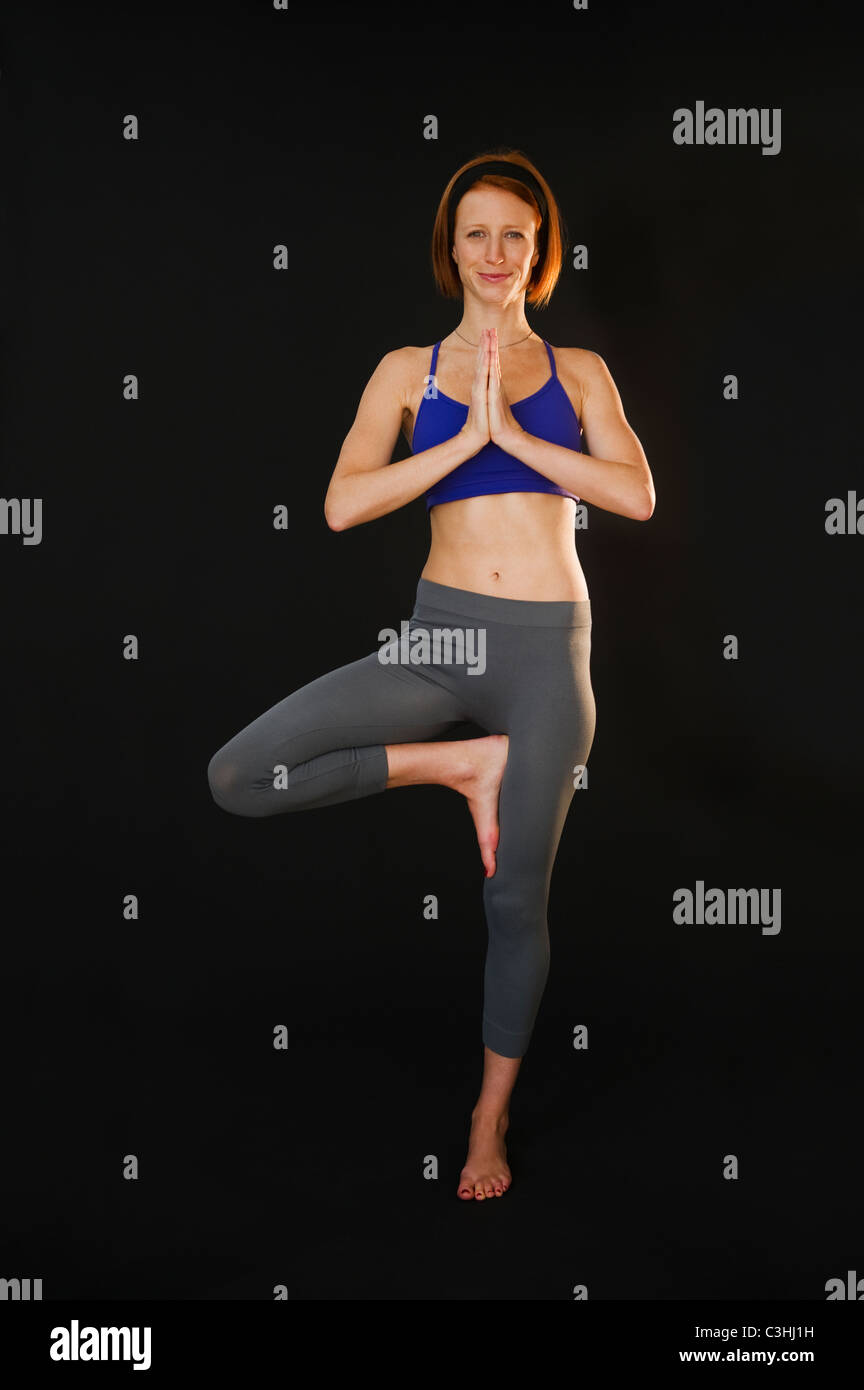 Shot woman doing yoga hi-res stock photography and images - Alamy