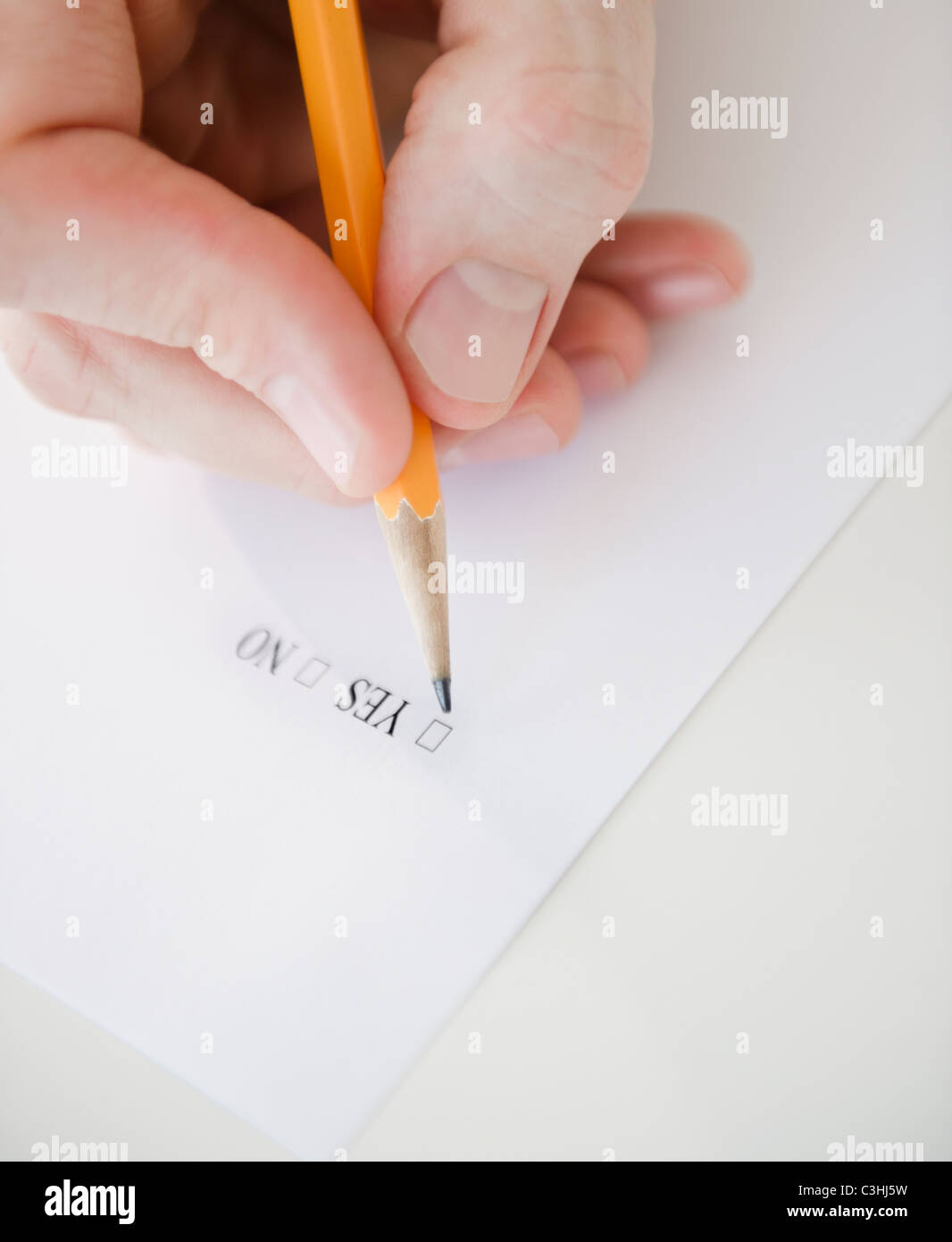 Hand filling document Stock Photo