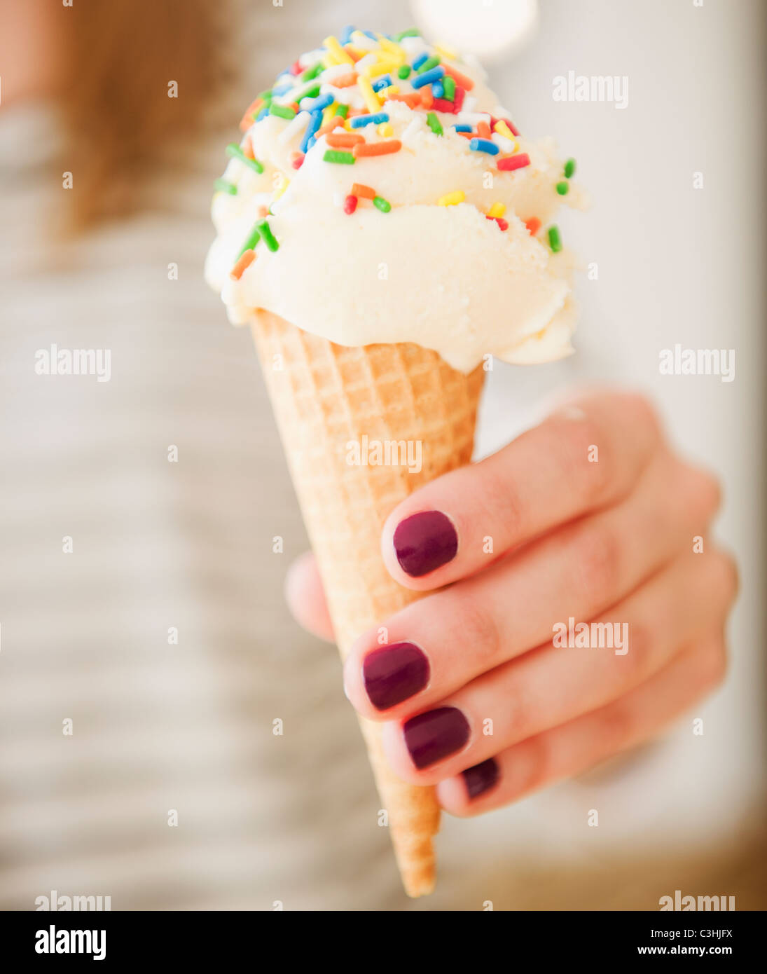 Female hand holding ice cream Stock