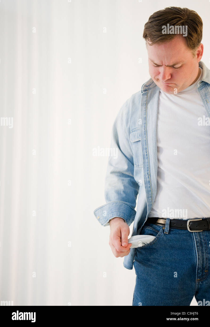 Man emptying pockets Stock Photo Alamy