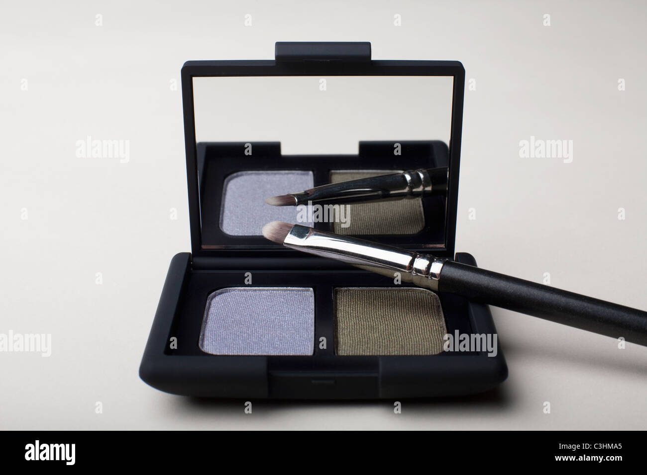 Powder compact with small brush Stock Photo Alamy