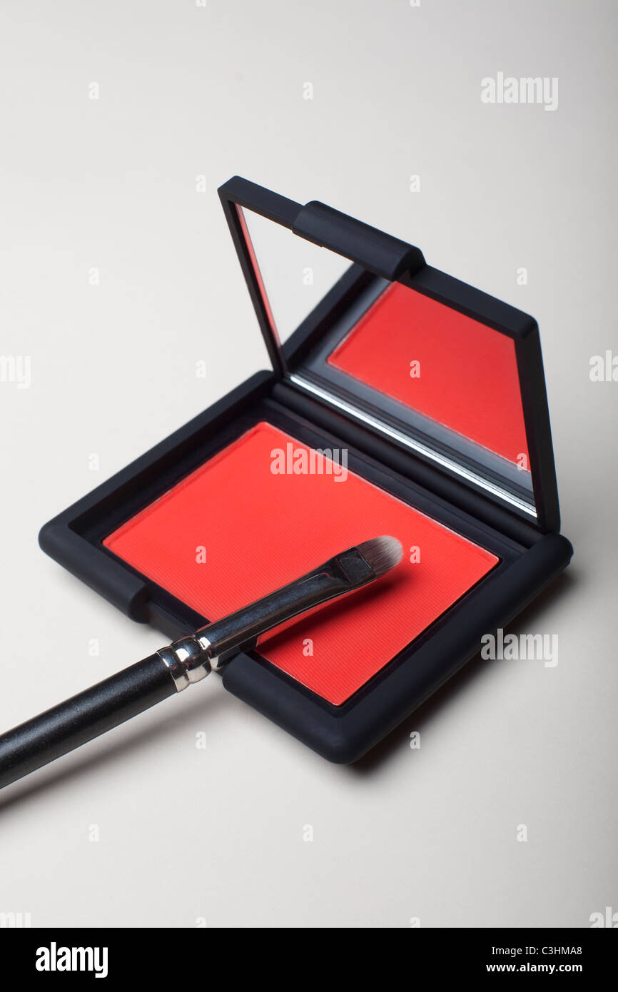 Powder compact with small brush Stock Photo Alamy