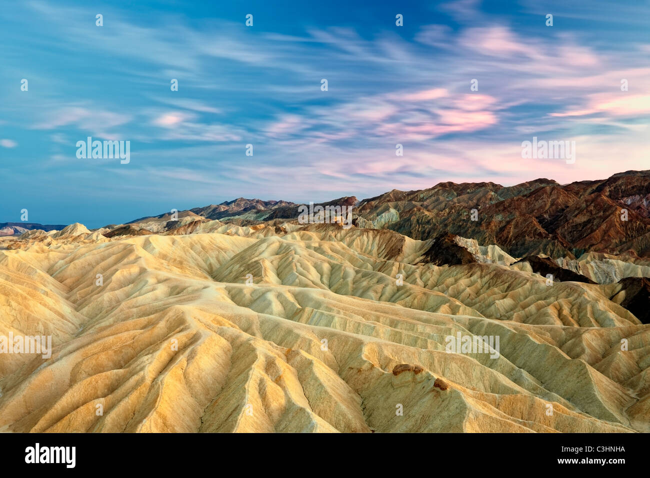 Sunset light over the colorful badlands of Golden Canyon in California's Death Valley National Park. Stock Photo