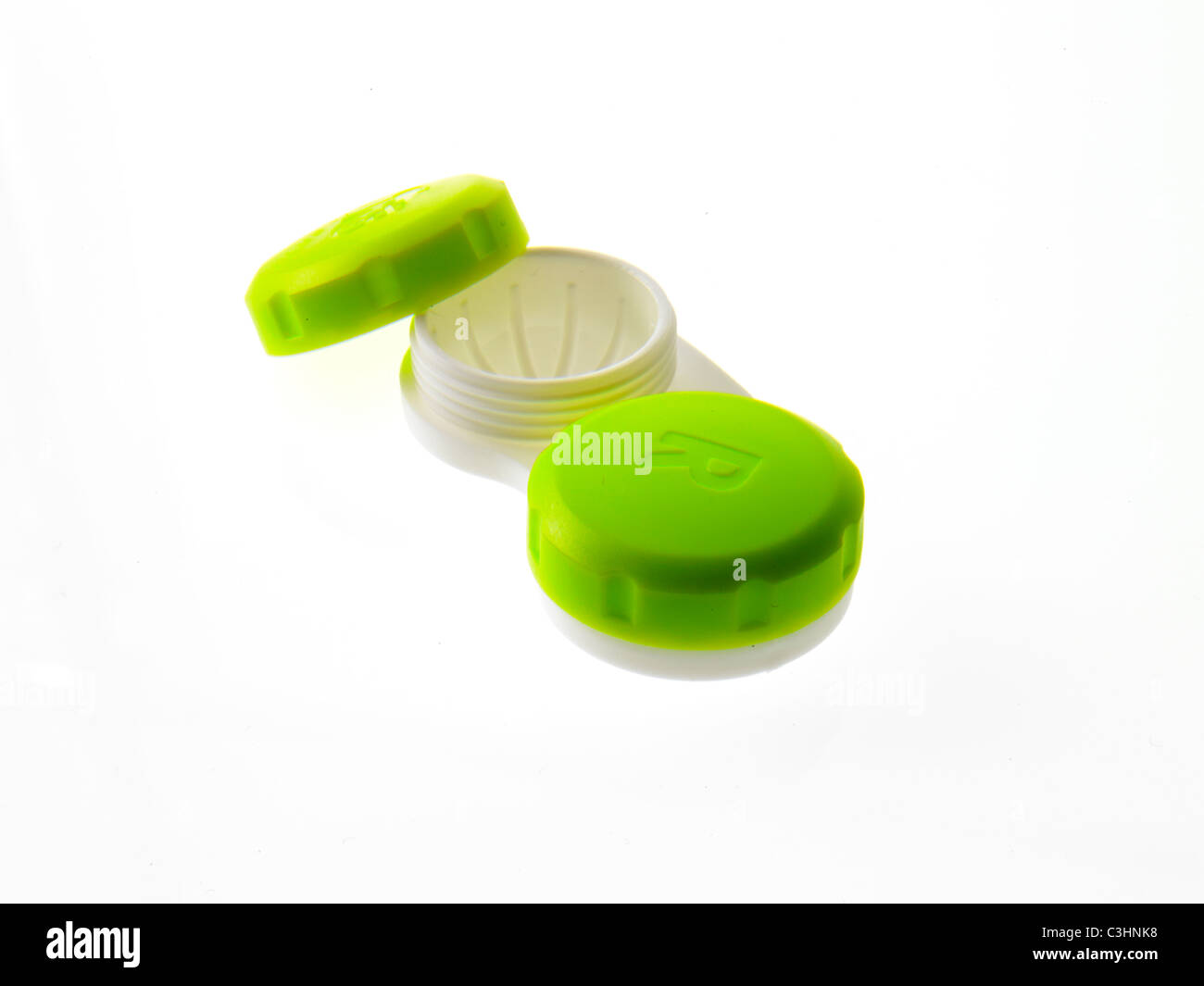 Green contact lens cases on white background Stock Photo