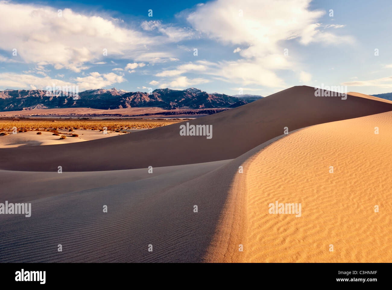 Morning light bathes the Mesquite Dunes in California's Death Valley National Park. Stock Photo