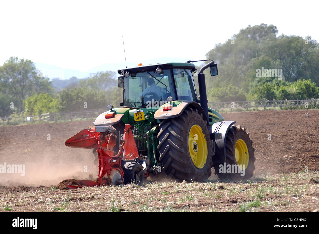 John Deere tractor ploughing, Worcestershire, England, UK Stock Photo