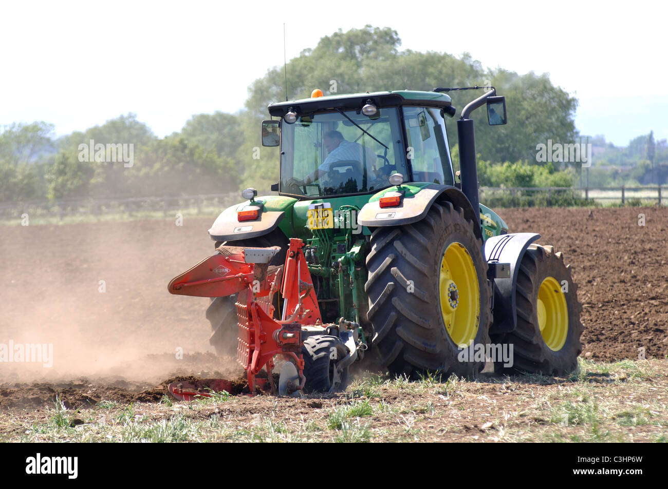 John Deere tractor ploughing, Worcestershire, England, UK Stock Photo