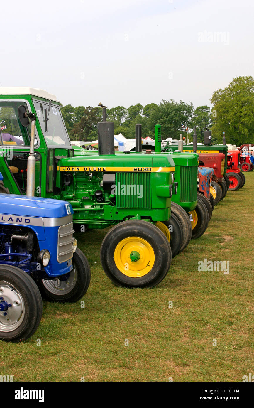 Collection of old farm tractors at an agricultural show in England