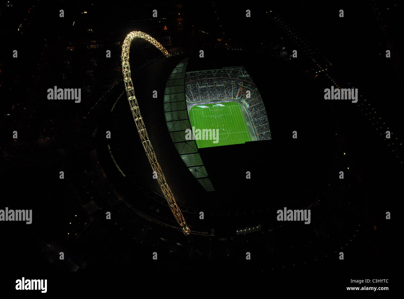 aerial shot of Wembley stadium during a England football international at night taken from a helicopter Stock Photo