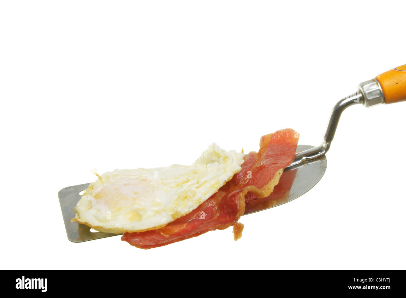 Single rasher of bacon picked up with kitchen tongs Stock Photo - Alamy