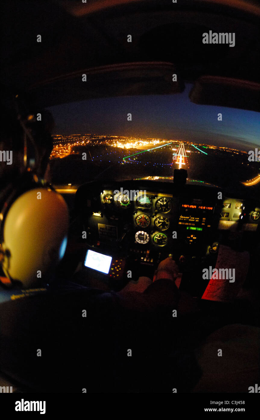 Night VFR flight approach on Liege airport with a small plane Cessna 172, Belgium Stock Photo