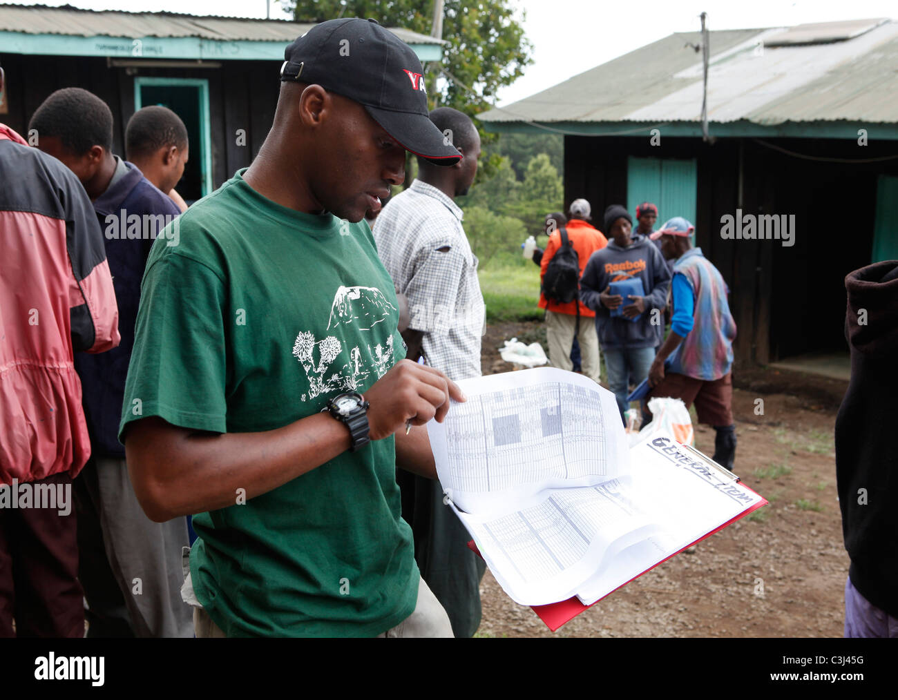 Local guides are preparing for the Kilimanjaro Climb, Marangu Route to Mt. Kilimanjaro, Tanzania, East Africa, Africa Stock Photo