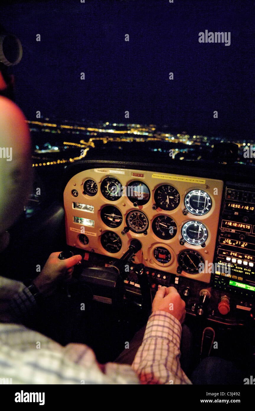 Night VFR flight in a small plane Cessna 172 over Luxembourg town Stock Photo
