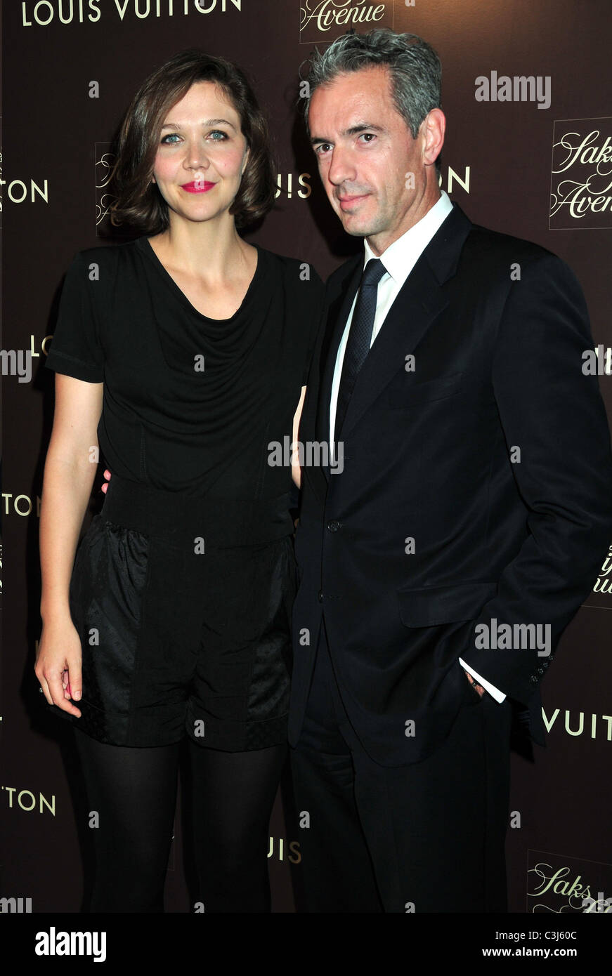 Maggie Gyllenhaal and President & CEO of Louis Vuitton North America Daniel  Lalonde Louis Vuitton 2010 Cruise Collection launch Stock Photo - Alamy