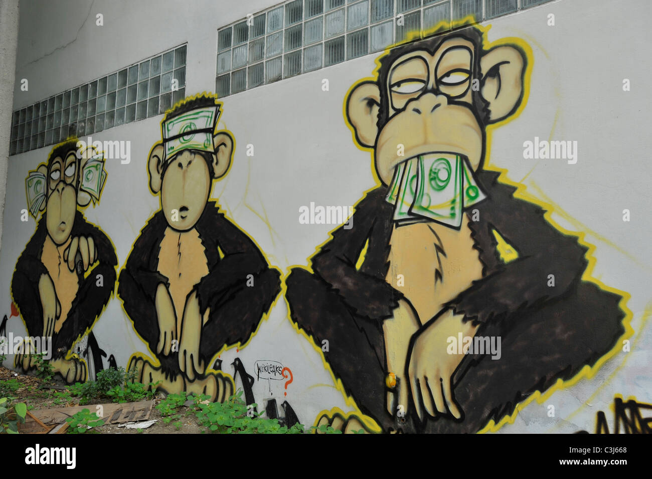 see no evil, say no evil, hear no evil, the three wise monkeys , graffiti on the wall, weird and bizarre art, bangkok, thailand Stock Photo