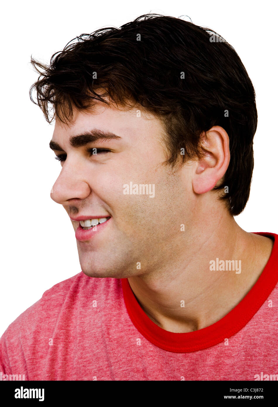 Smiling young man posing isolated over white Stock Photo - Alamy