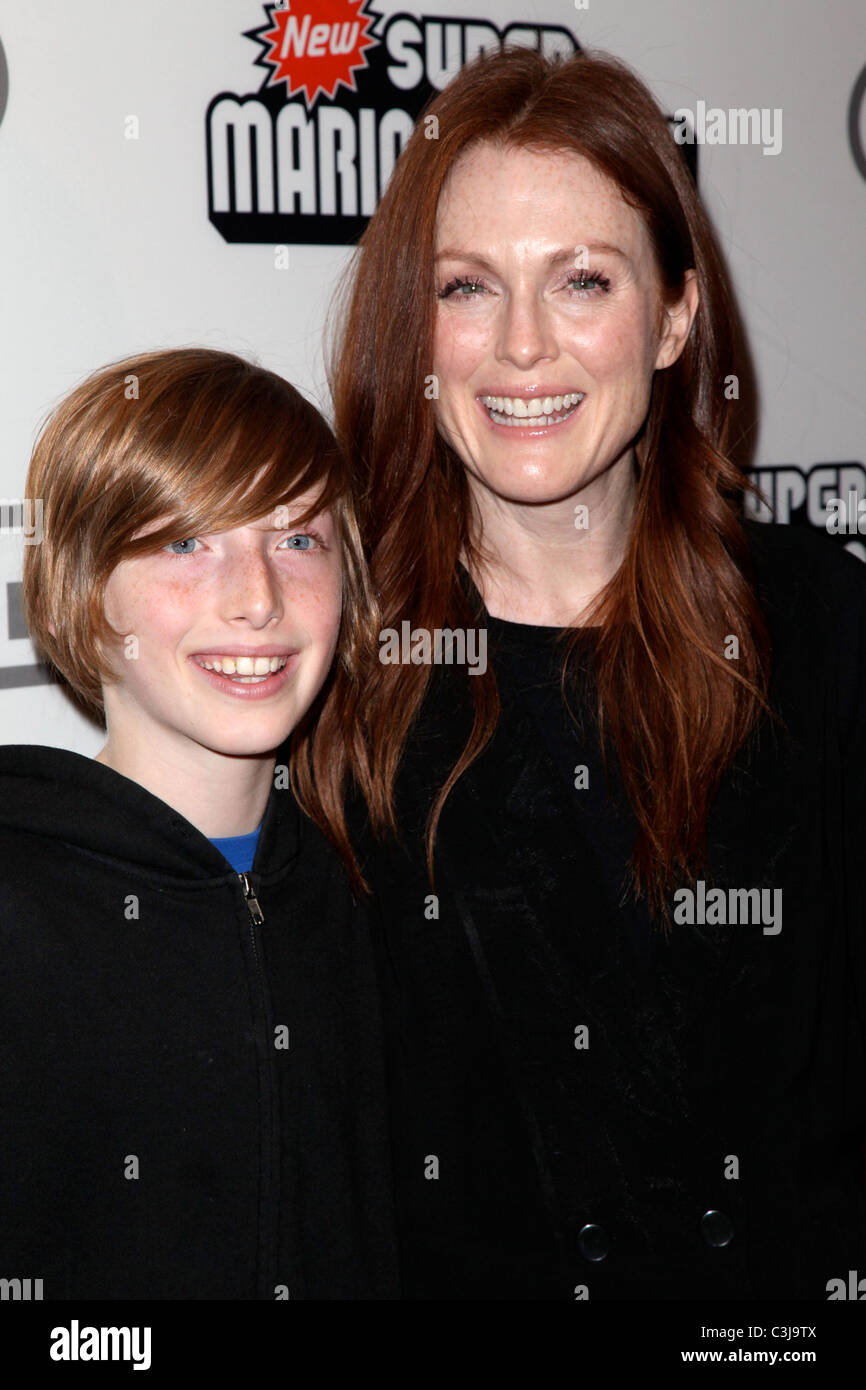 Caleb Freundlich and Julianne Moore  25 years of Mario celebration at the Nintendo World Store New York City, USA - 12.11.09 Stock Photo