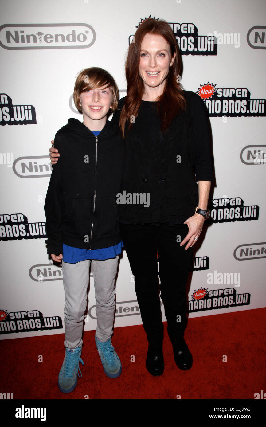Caleb Freundlich and Julianne Moore  25 years of Mario celebration at the Nintendo World Store New York City, USA - 12.11.09 Stock Photo
