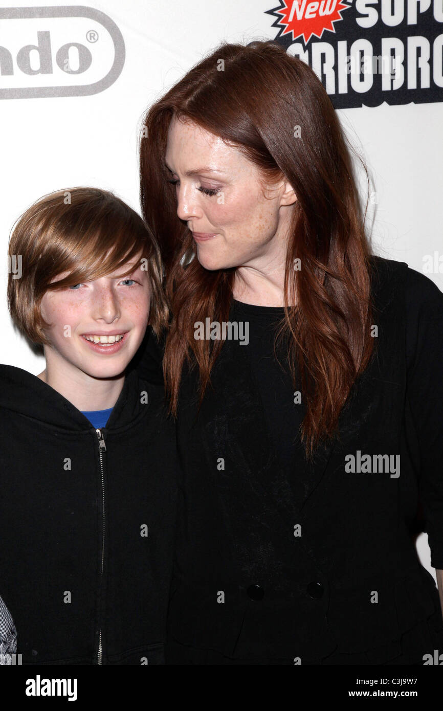 Caleb Freundlich and Julianne Moore  25 years of Mario celebration at the Nintendo World Store New York City, USA - 12.11.09 Stock Photo