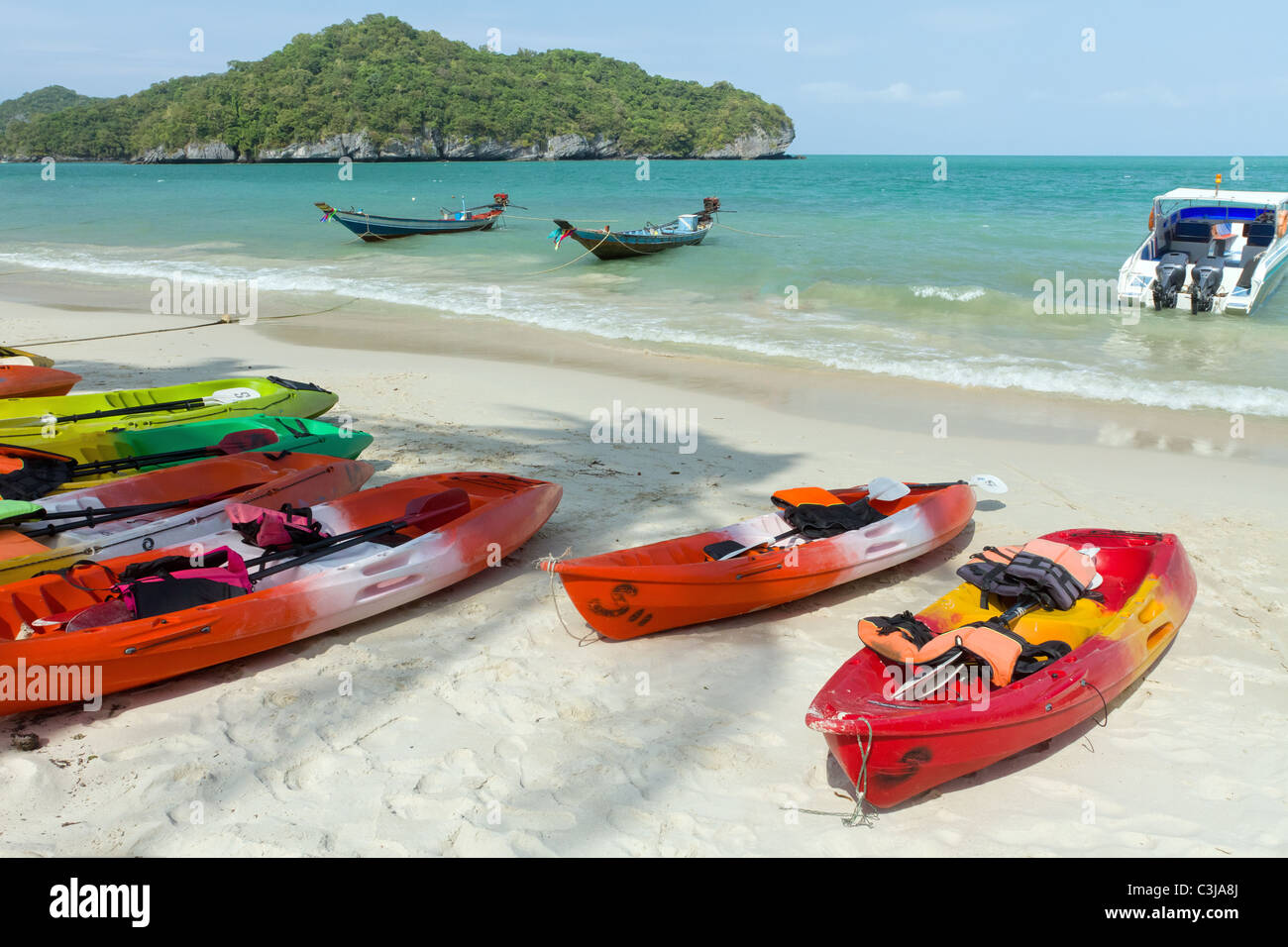 tropical beach with canoe and speedboat, angthong marine park, thailand Stock Photo